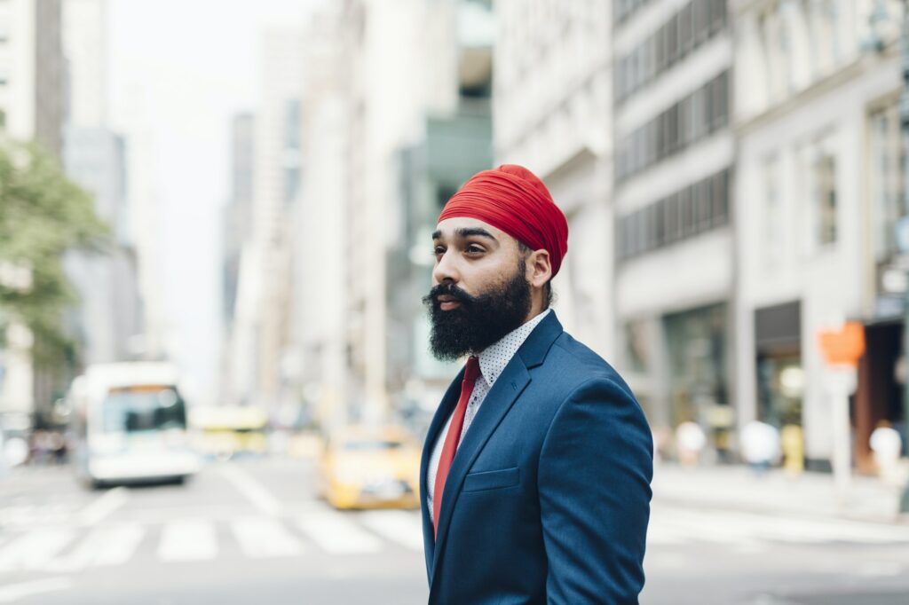 Indian businessman crossing street in Manhattan