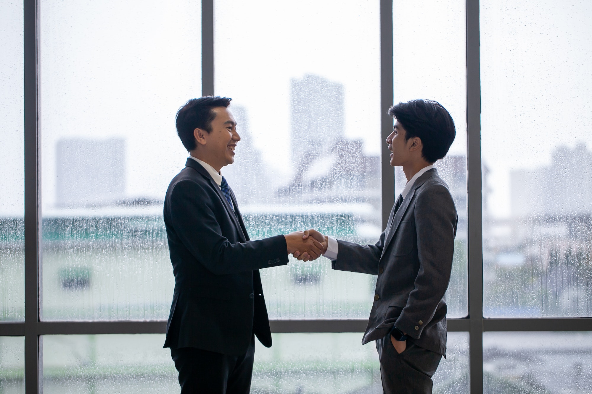 Teamwork Deal Cooperation Partnership business people shaking hands.